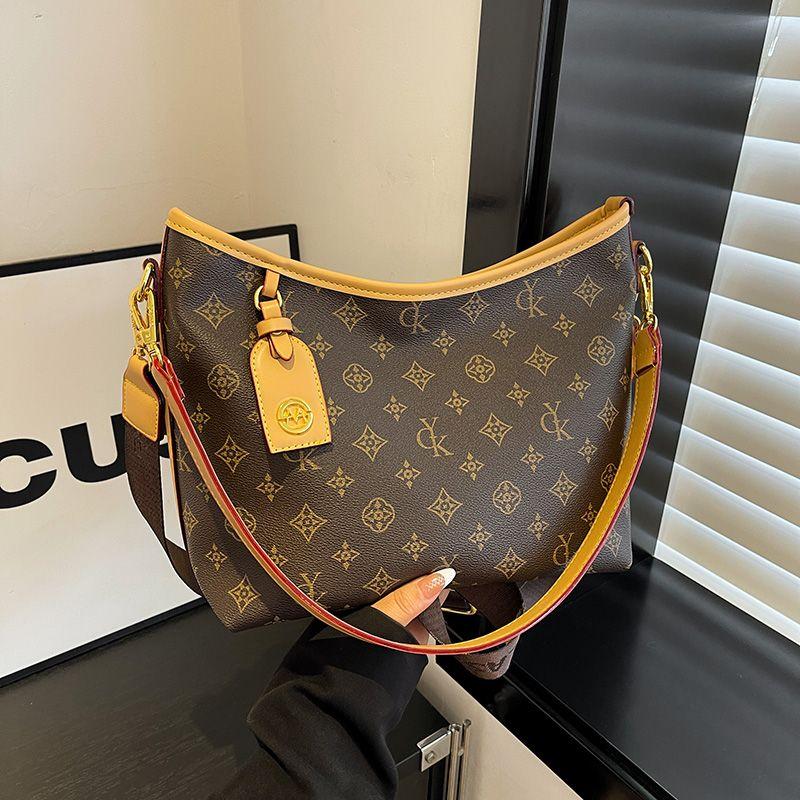 

Сумка большой вместимости для женщин 2024 Новое поступление Осень и Зима Сумка-тоут для通勤 Модная наплечная сумка с широким ремнем Сумка кроссбоди Khaki.