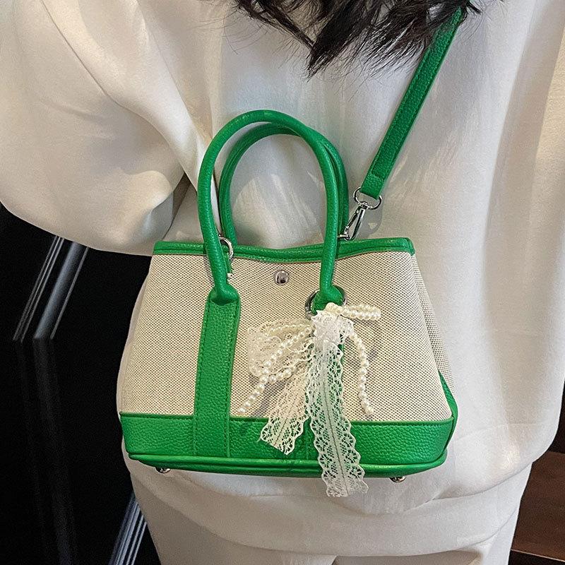 Wholesale Korean version of casual niche contrasting color portable bucket bag commuting versatile simple personality messenger women's bag