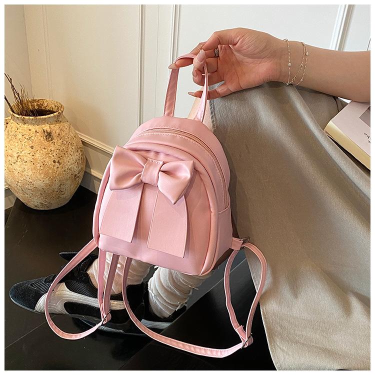 Sac à dos en cuir synthétique style coréen avec nœud papillon pour femme Sac à bandoulière matelassé léger