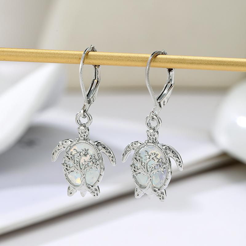 

2026 Classic Hollow Pattern Turtle Style Earrings, Paired with Imitation Opal Pendant, Women s Fashion Zircon