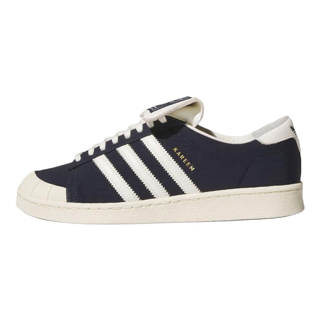 נעלי סניקרס יוניסקס Willy Chavarria x adidas Jabbar Low דיו לבן אוף לבן כחול אגדי-דיו קרם-לבן KJ4550