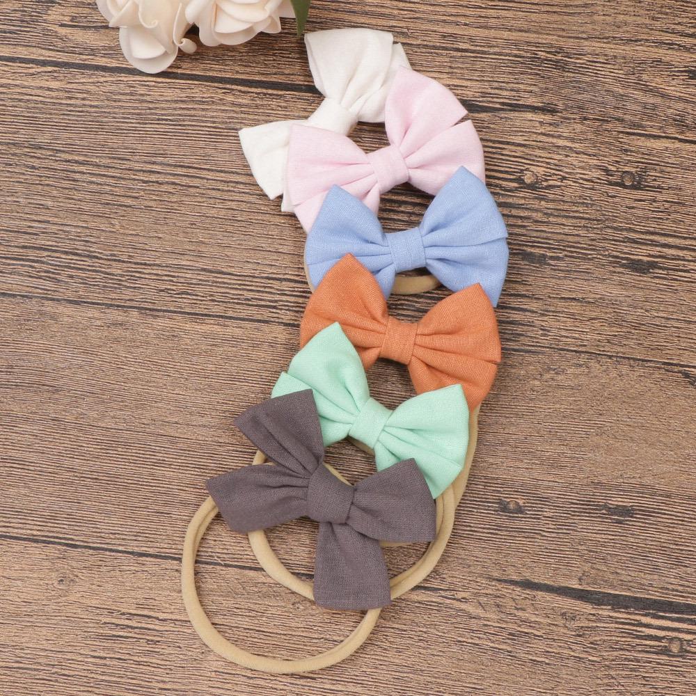 Baby-Stirnband-Set aus Nylon und Baumwolle: Stirnbänder mit Schleife und Leinen in Geschenkbox.