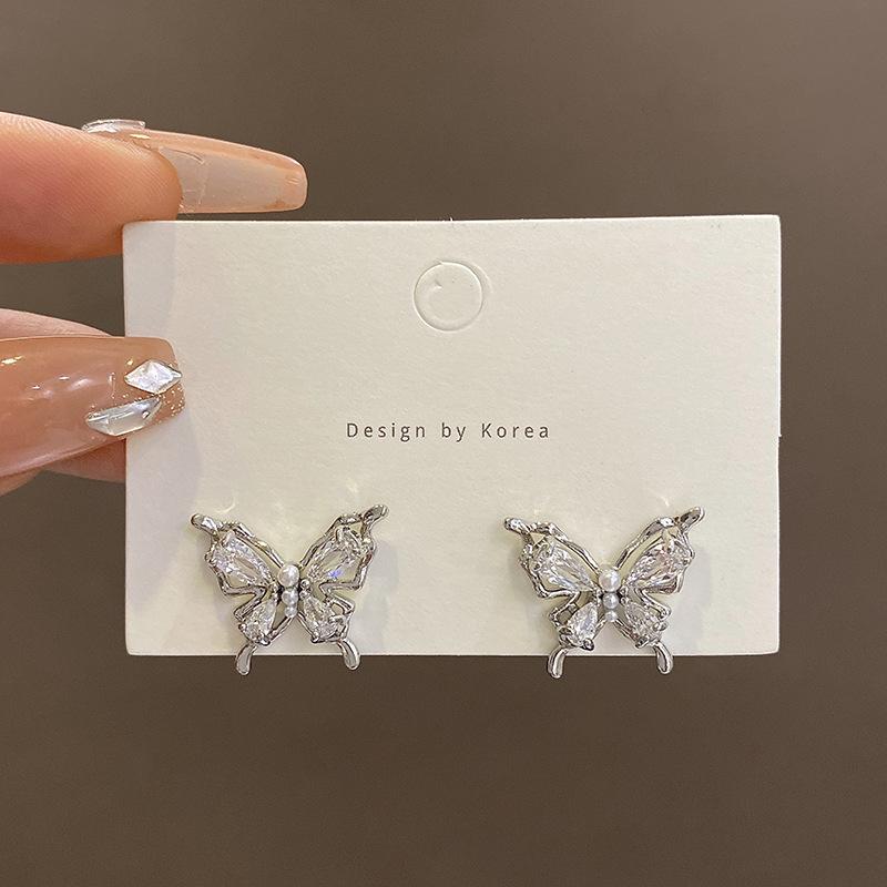 S925 silver needle small butterfly pearl earrings women s light luxury niche design stud earrings Korean foreign style earrings