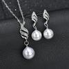 Simple faux pearl pendant necklace and earrings inlaid with rhinestones, creative spiral-shaped bridal accessories to match wedding dresses, suitable