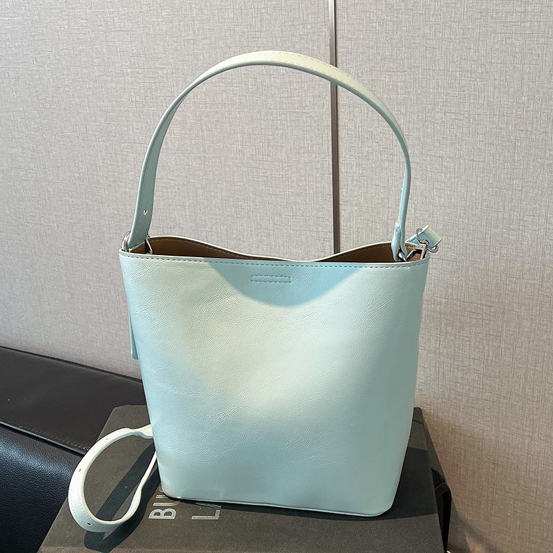 

Wholesale hot sale Korean version simple solid color versatile portable bucket bag women s fashion casual style commuter super fire messenger bag