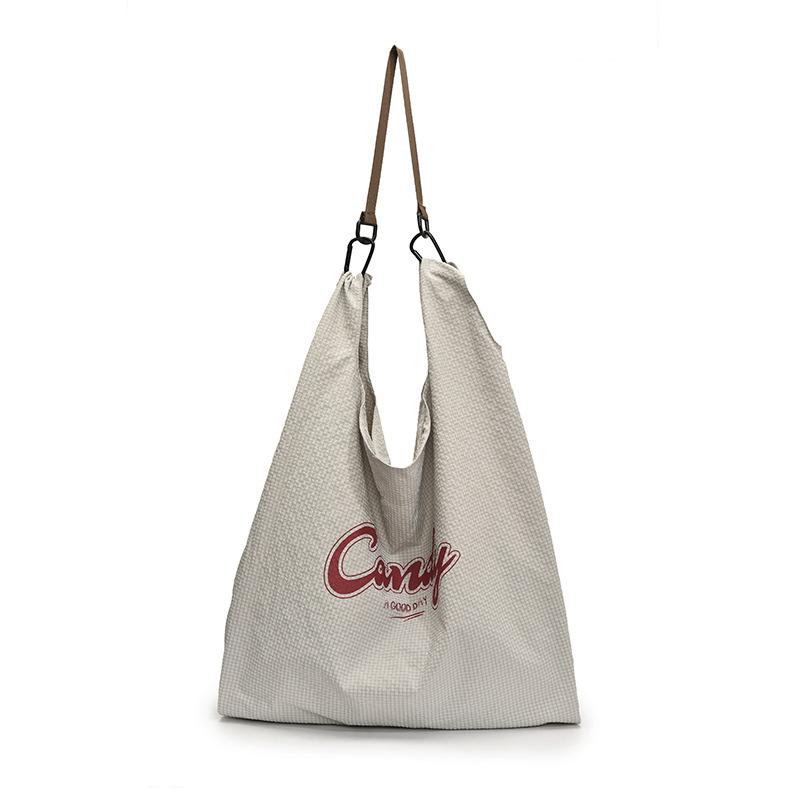 Casual large-capacity canvas bag literary niche underarm bag women's 2025 new letter tote bag shopping bag bag