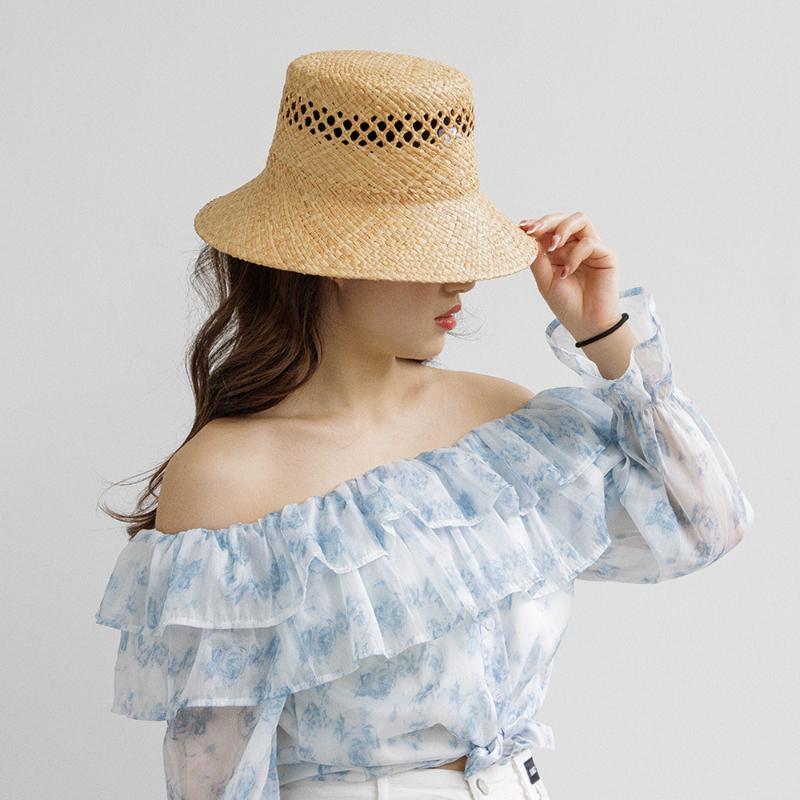 2025 New Arrival Hand-made Hollow Raffia Sun Hat Spring and Summer Fashion Retro Flat Top Outdoor Sunshade Straw Hat Bucket Hat