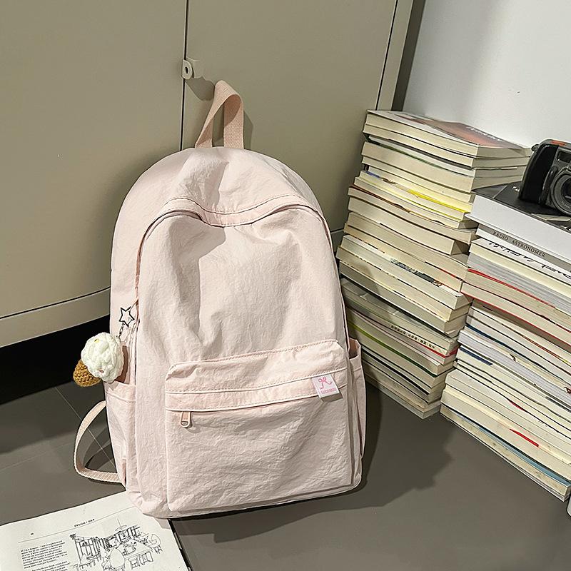 Japanese simple solid color schoolbag female college student casual versatile backpack large capacity junior high school student travel backpack