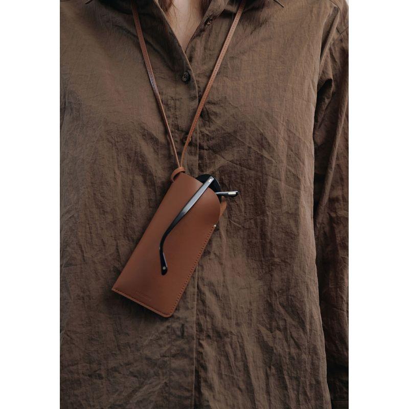 

Горячая девушка Импортный Первый слой Коровья кожа Кожа Мундал Ремешок Чехол для очков Удобный Холтер Сумка для солнцезащитных очков Black