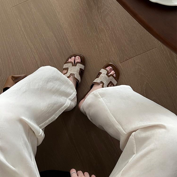 French Temperament Flat-bottomed Roman Cool Slippers Women's Summer Wear 2025 New One-word Drag Seaside Casual Lazy Shoes