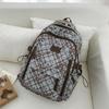 Schoolbag Korean plaid star backpack for female middle and high school students, large-capacity schoolbag, light and dirt-resistant versatile backpack