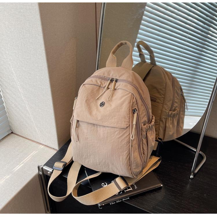 

Leisure short trip backpack women 2025 new student large-capacity schoolbag lightweight simple travel backpack tide хаки