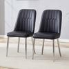 Two Black Faux Leather Dining Chairs: Modern and Minimalist Design, Equipped with Widened Seat, Backrest and Silver-Colored Metal Legs.
