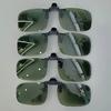 A pair of stylish four-piece flip-on polarized night vision sunglasses with an anti-glare mirror coating, ideal for driving.