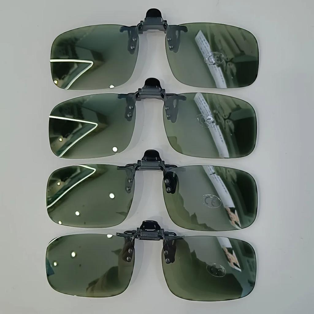 A pair of stylish four-piece flip-on polarized night vision sunglasses with an anti-glare mirror coating, ideal for driving.