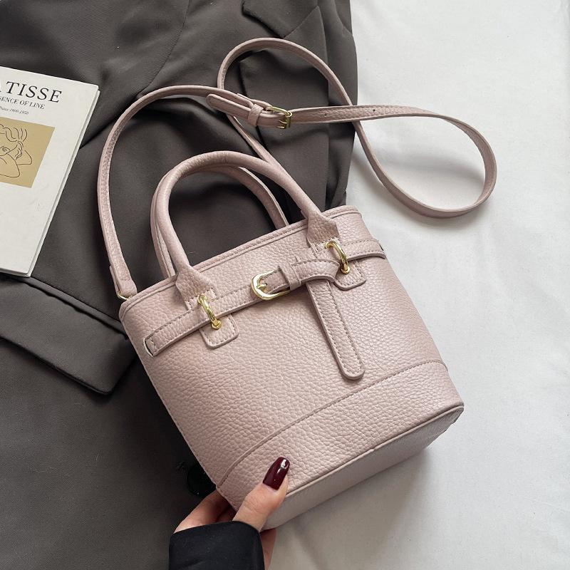Hot sale in spring and summer Korean simple lychee pattern texture portable bucket bag casual commuting versatile solid color messenger women's bag