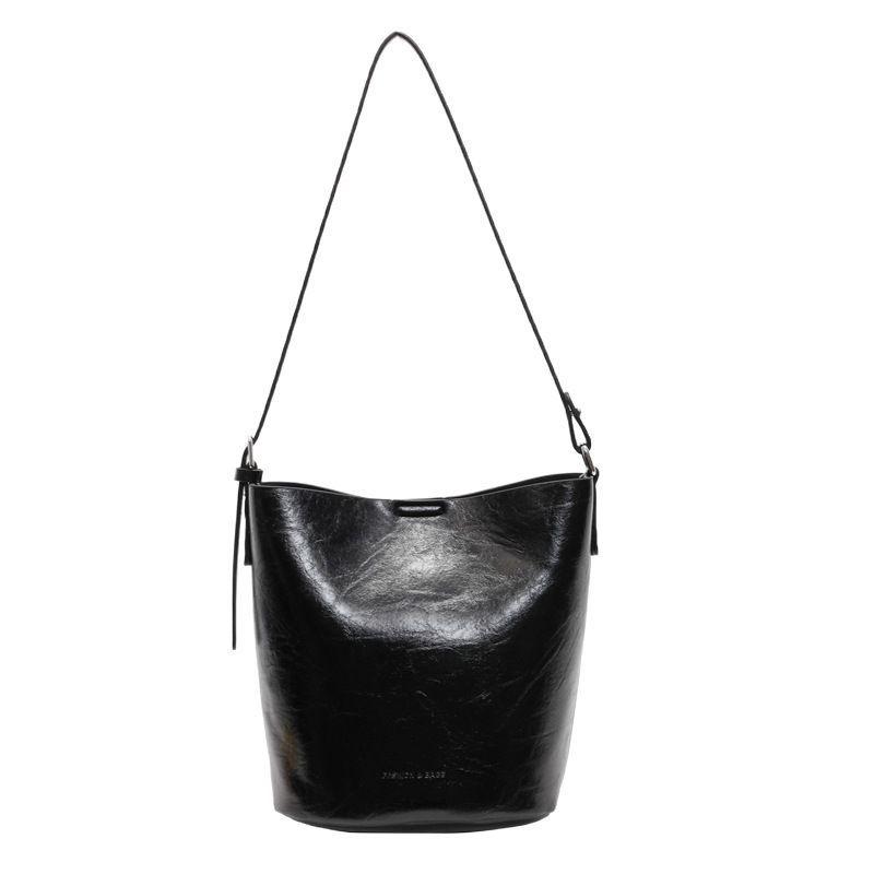 Einfache Tasche in Unifarbe Damen neue High-End-Textur Nische Pendlertasche Eimertasche Umhängetasche