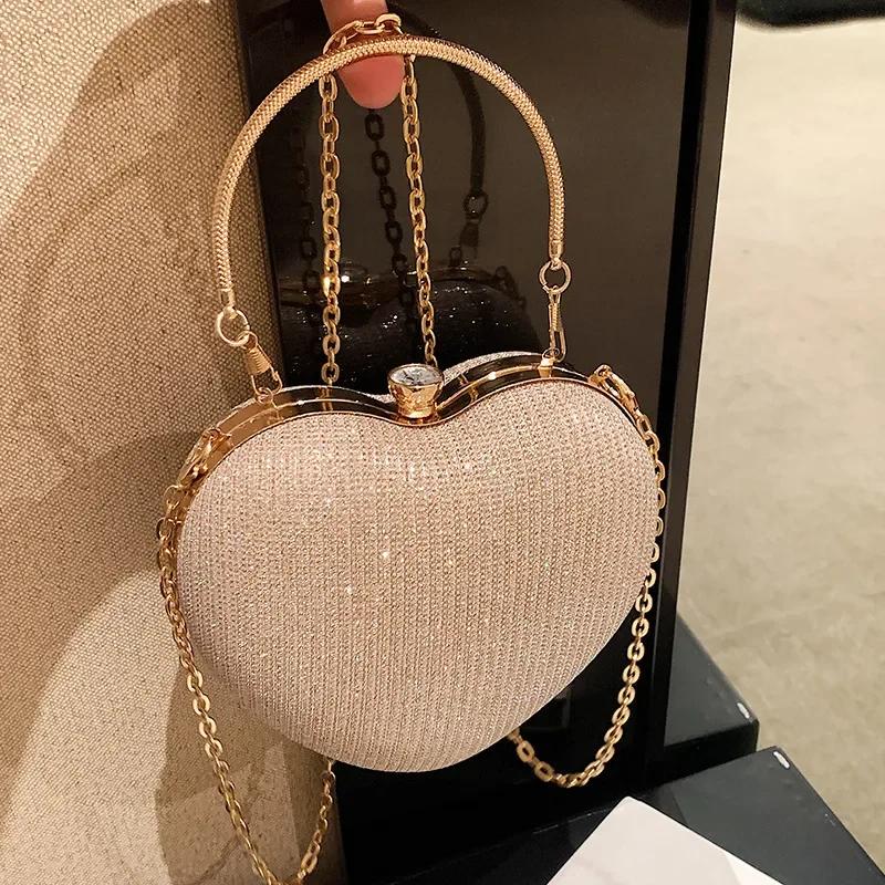 Borsa da sera con pochette, borsa da donna, borsa a mano lucida, a forma di cuore, in metallo, borsa a tracolla con catena alla moda, borsa di lusso da donna.