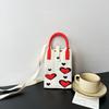 New love mobile phone bag high-end knitted bag popular cartoon cute portable storage messenger bag