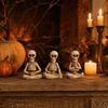 Halloween Skeleton Resin Figurines Set of 3 Sitting Skeletons with Pumpkin Heads Decorative Statues for Seasonal Tabletop Display or Shelf Decoration