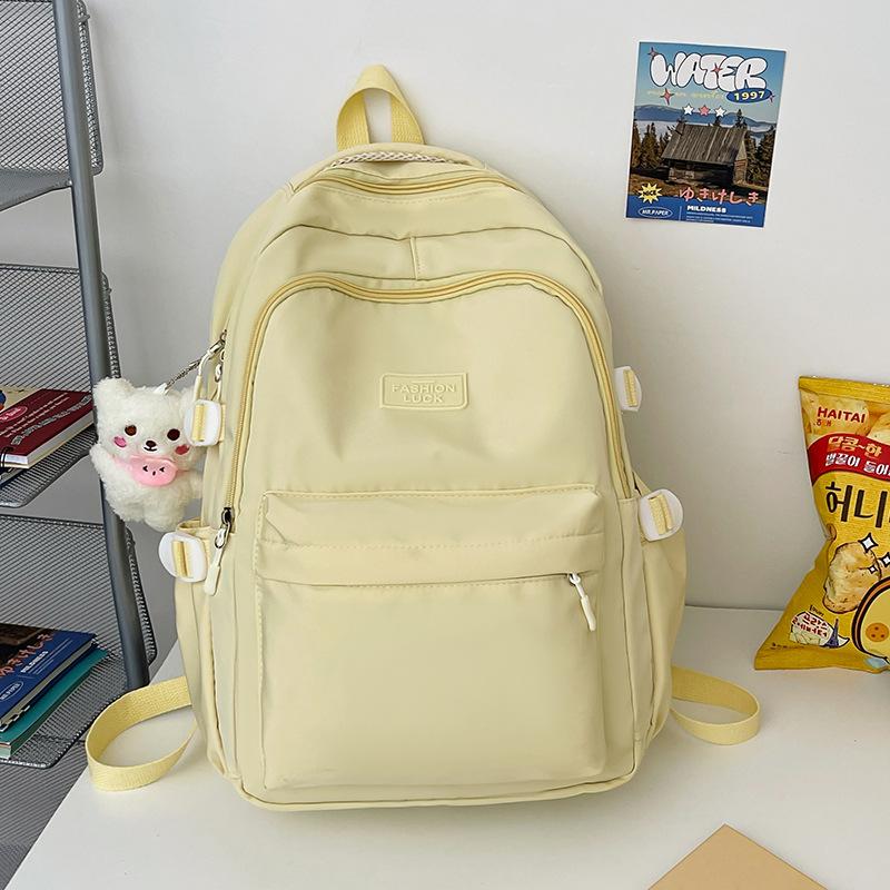 School bag female Japanese junior high school student high school student backpack female large capacity solid color simple computer bag backpack