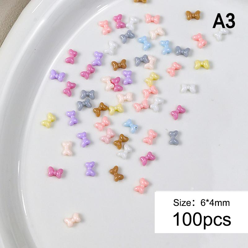 

100Pcs Cute Bow Nail Charm Multi Colors Bows Nail Art Accessories Flatback Resin Rhinestones Nails Decor Parts A3