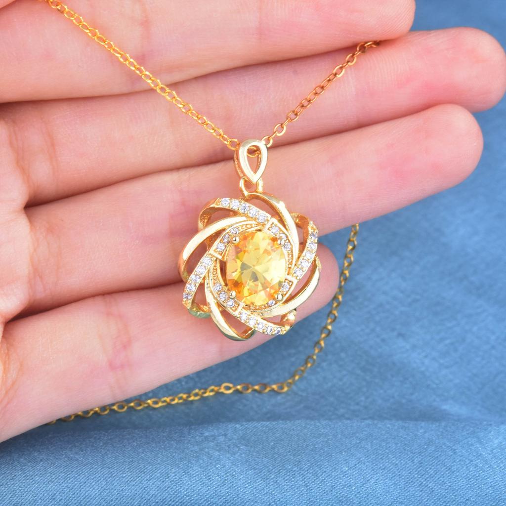 European and American atmospheric imitation yellow crystal pendant creative rotating windmill pendant inlaid with 18K gold inlai