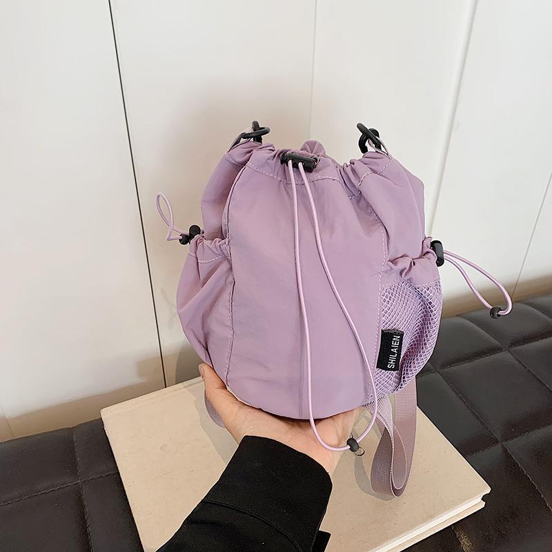 Niche Design Nylon Bucket Bag Women's 2026 Spring New Fashion Super Fire Drawstring Shoulder Messenger Bag