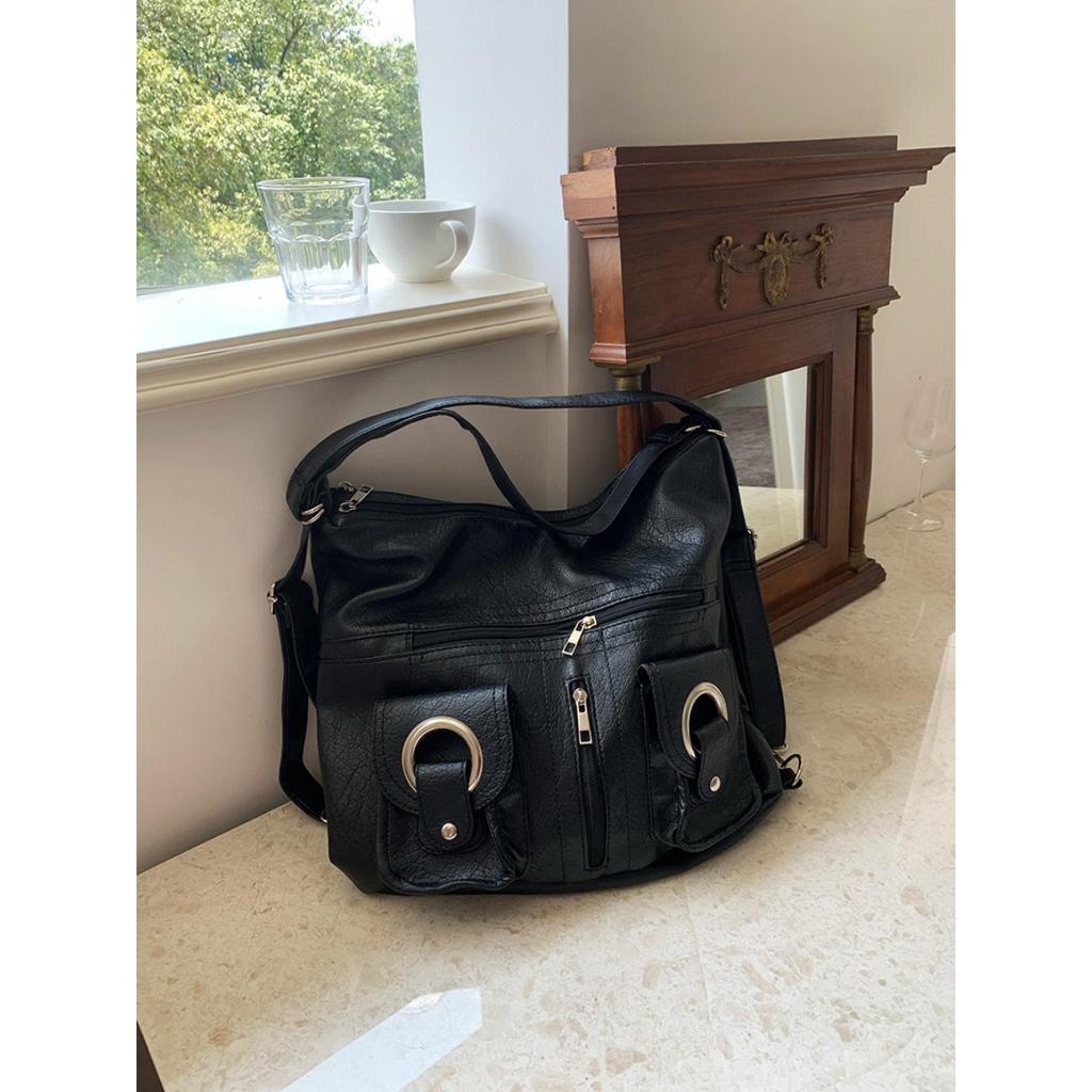 Koreanische Version Schlichte Persönlichkeit Vielseitig Modisch Reißverschlusstasche PU-Leder Tragetasche Schultertasche Pendeln Große Kapazität Rucksack