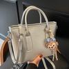 New High-end Korean Version Hugh Simple Portable Bucket Bag Versatile Commuter Fashion Niche Messenger Bag Bag Woman
