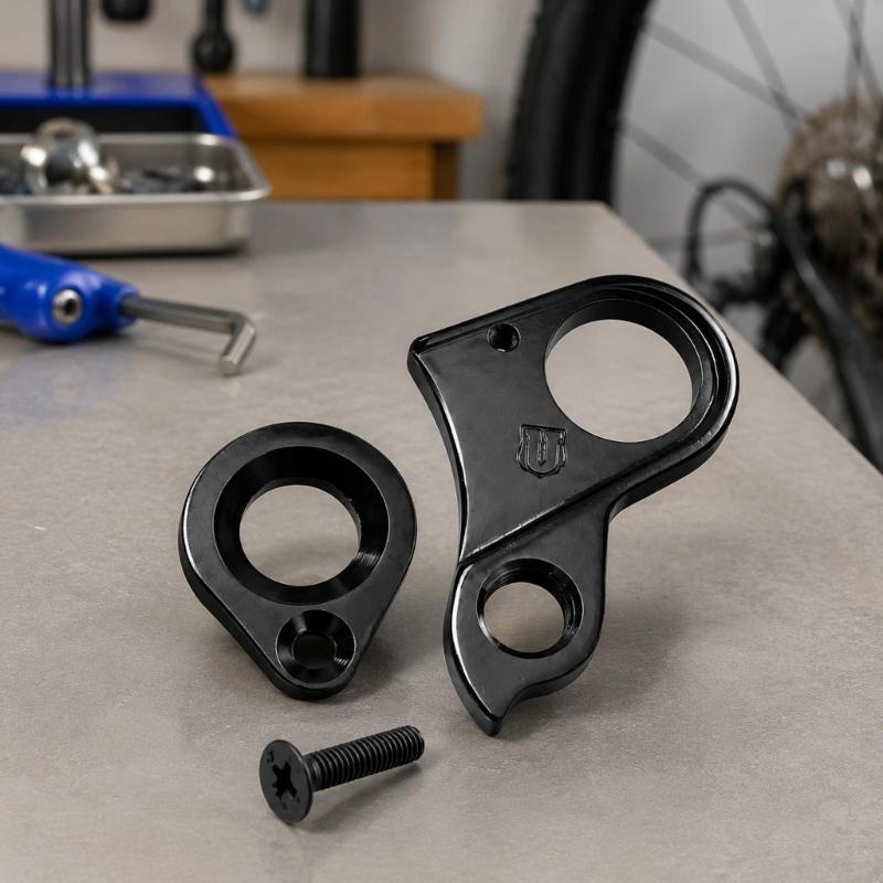 Machined Aluminum Rear Shifting Hanger, Part 10240 H695 with Frame Opening, Bushing Connection, Screw Mounting Point, and Included Screw