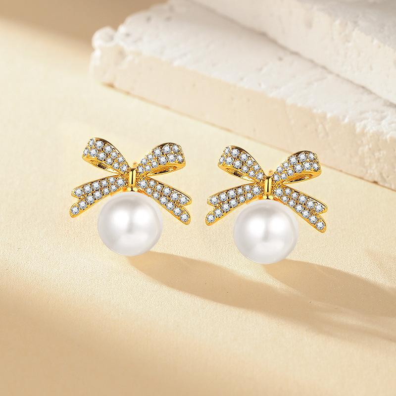 Japan and Korea Exquisite Micro-inlaid Zircon Bow Pearl Stud Earrings Women s Fashion Simple Small Versatile Earrings 2026