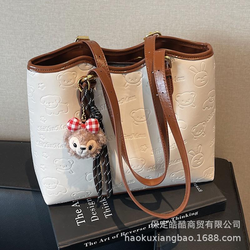 High-end contrasting color large-capacity bag women's 2025 new fashion commuter shoulder college student portable tote bag