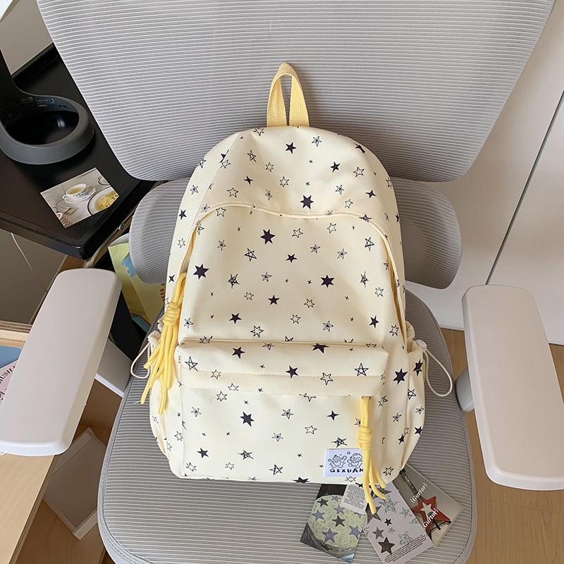 Star-Printed Backpack with Front Zipper Pocket and Tassel Details for School and Daily Use