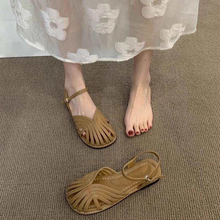 Mori baotou sandals female 2025 summer new fairy wind woven Roman shoes hollow flat bottom pig cage beach shoes