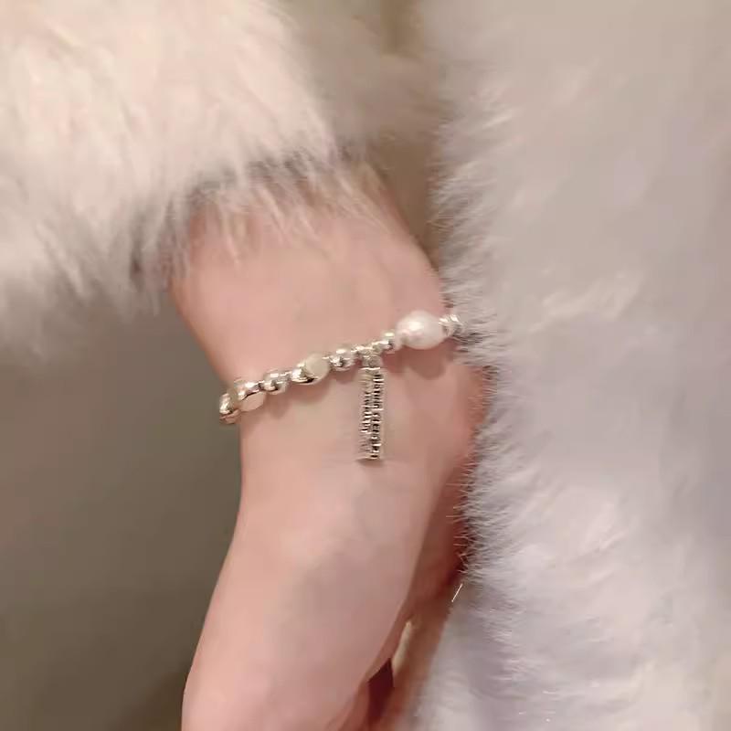 Exquisite Irregular Pearl Bracelet: Light Luxury Elastic Rope Design for Women