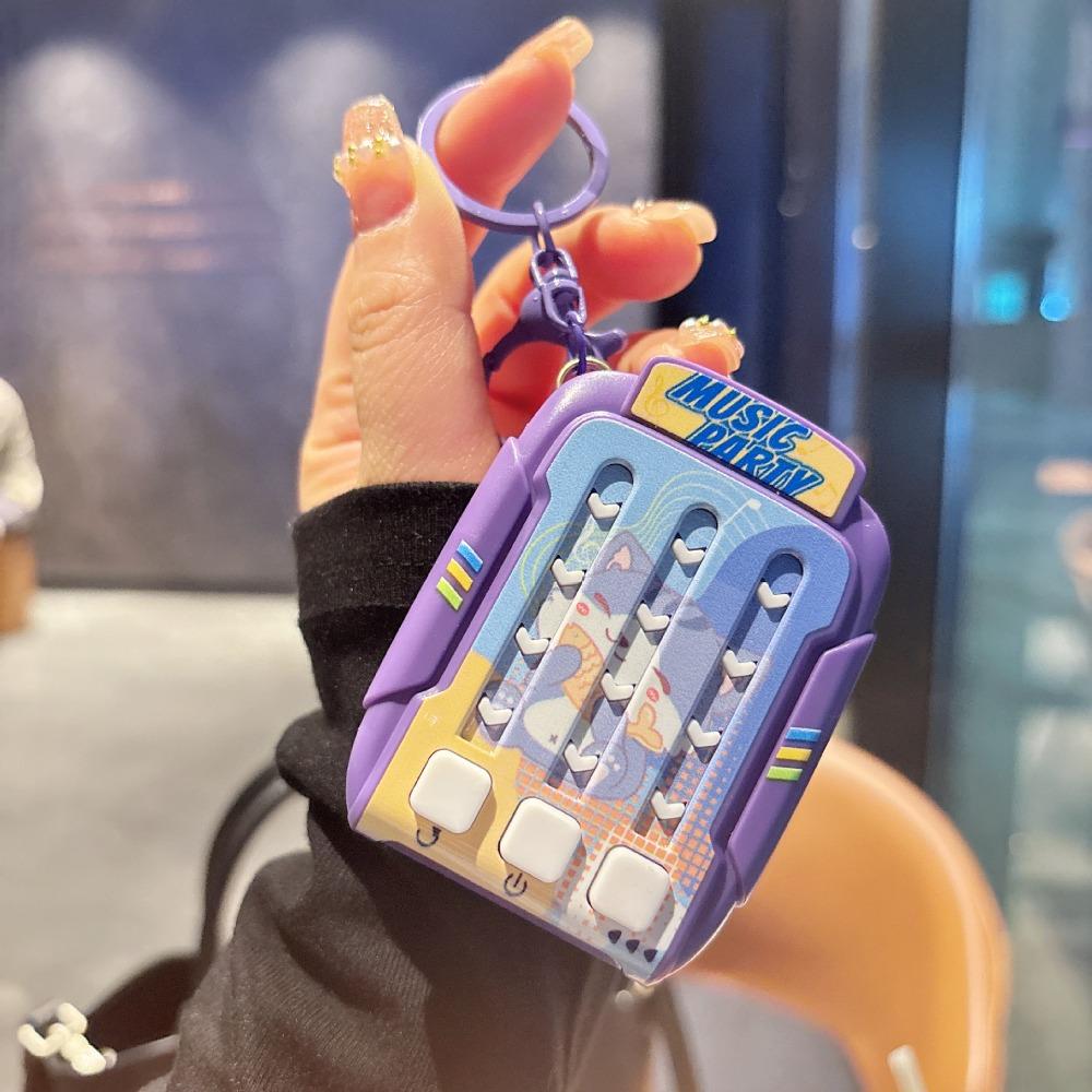 

Брелок Танцевальный автомат для снятия стресса Мультяшный Электрический Быстрое нажатие Ритм-игра фиолетовый