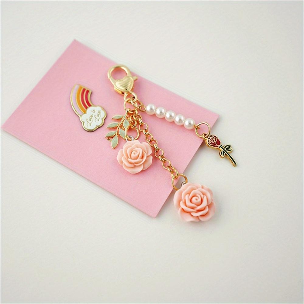 3D ვარდის ფისოვანი კამელიის გულსაკიდი გასაღების საკიდი მარგალიტის შენადნობი ქალებისთვის მანქანის გასაღების საკიდი ყურსასმენის ქეისი ხელჩანთის აქსესუარები