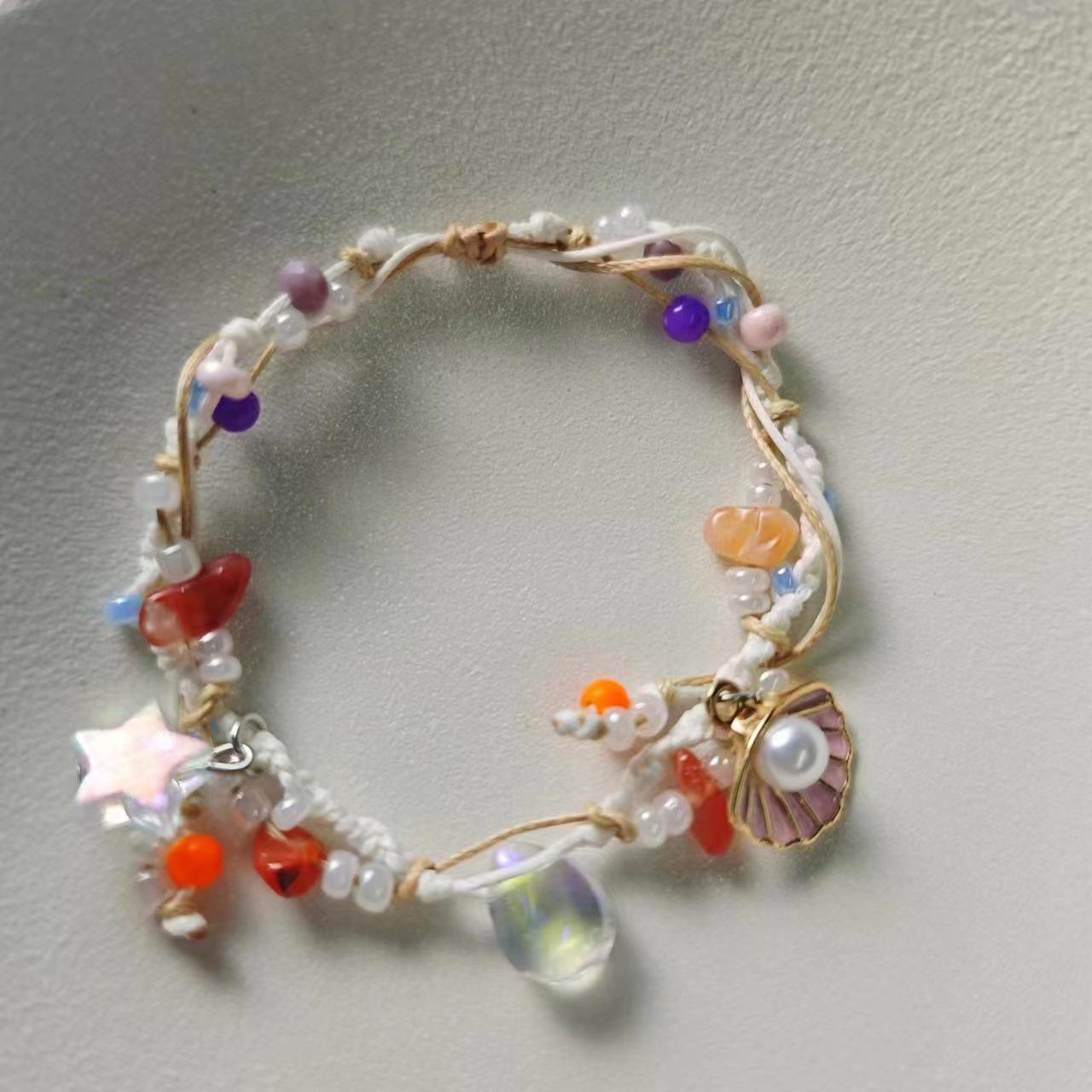 

Уникальный красочный браслет в виде пятиконечной звезды с каплей воды и акцентами из жемчуга Drop Shell