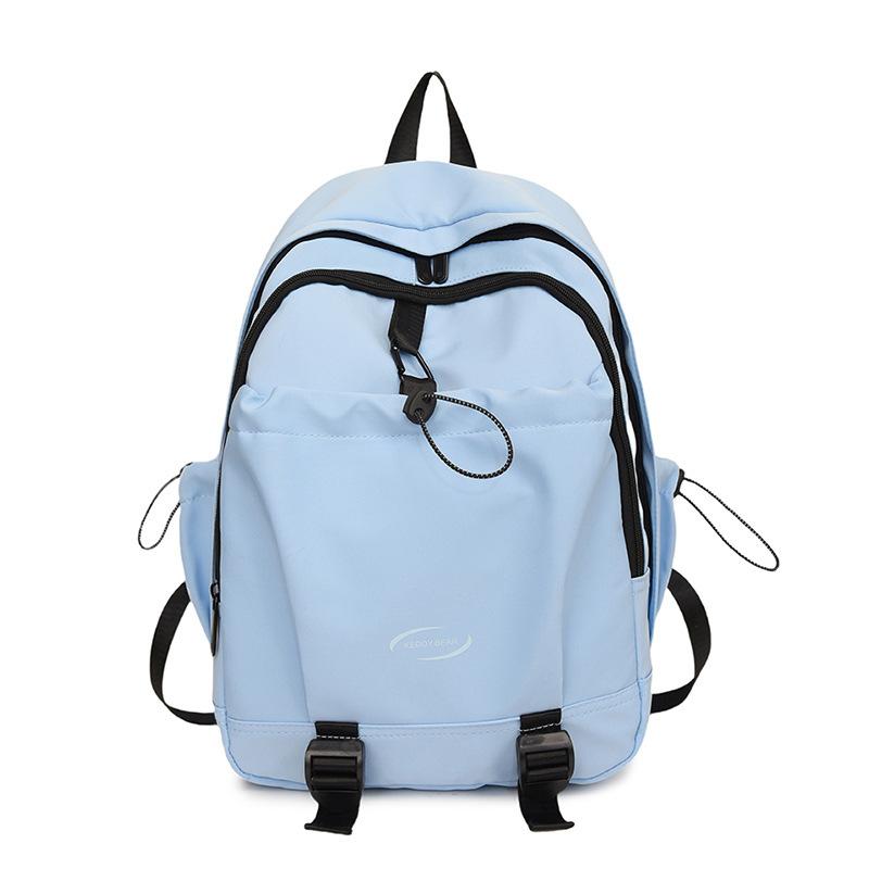 Koreansk version av enfärgad enkel och mångsidig ryggsäck med stor kapacitet för grundskoleelever