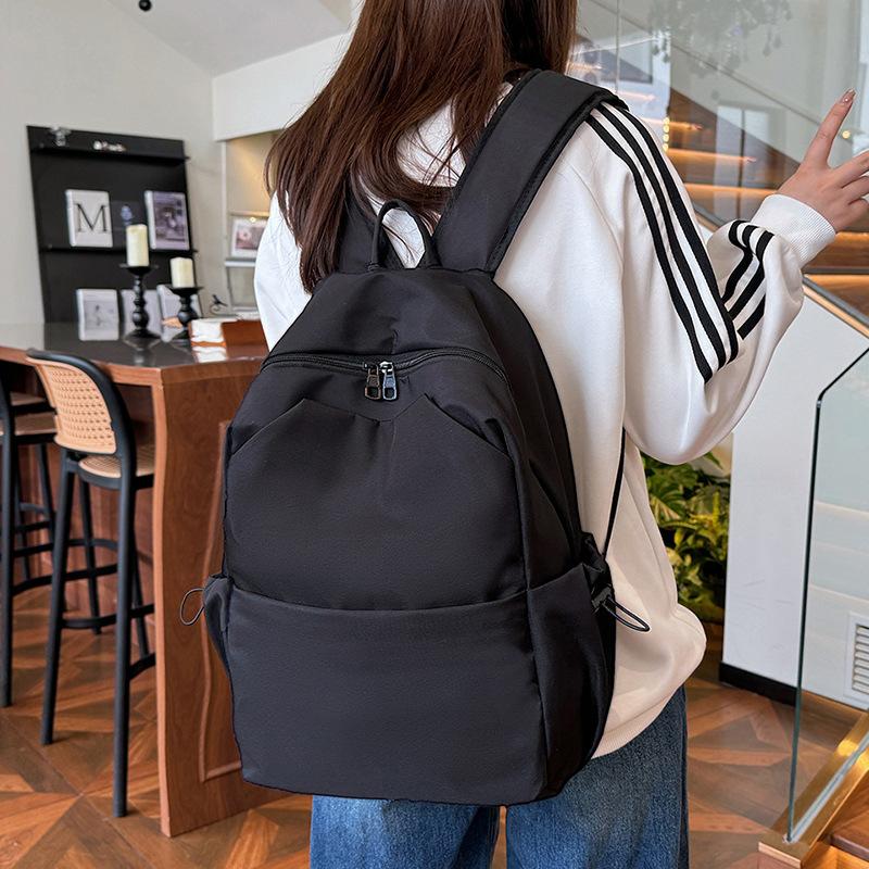 Schoolbag new versatile solid color large-capacity backpack women's schoolbag male college student junior high school student casual computer bag