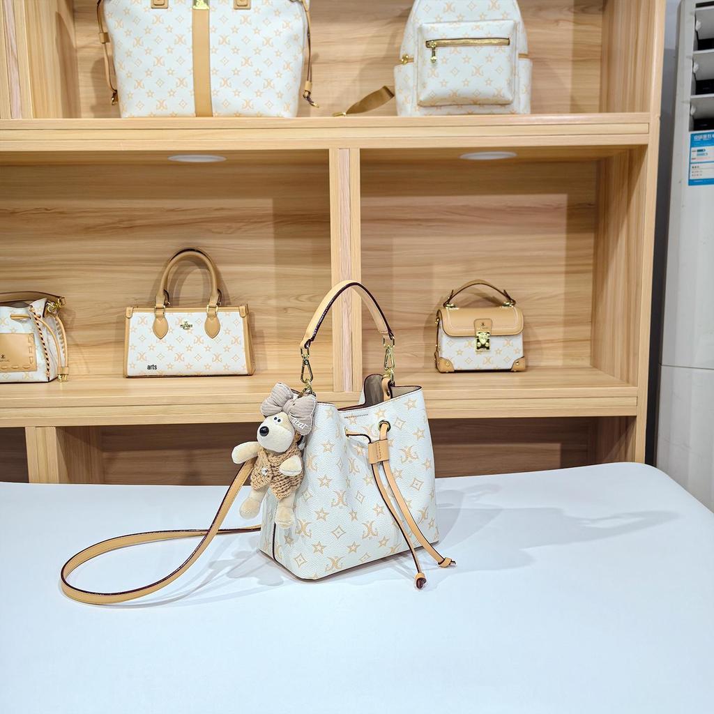 Women's Large Capacity Single Shoulder Bucket Bag with Inner Lining, Compartment Organizer, and Zippered Middle Section.
