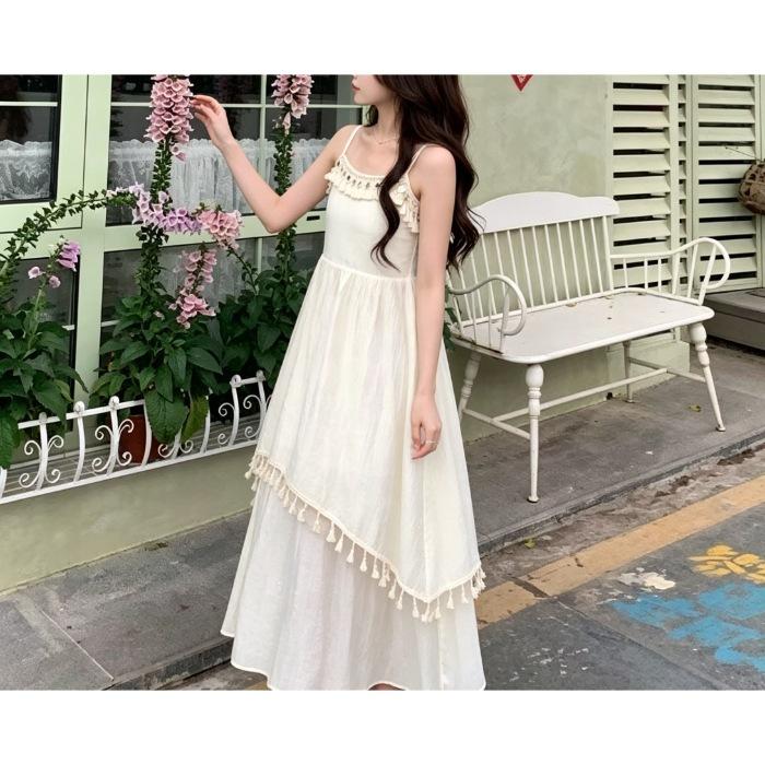 Japanese temperament fringed big pendulum medium and long dress new waist and thin holiday style super fairy sleeveless white polyester
