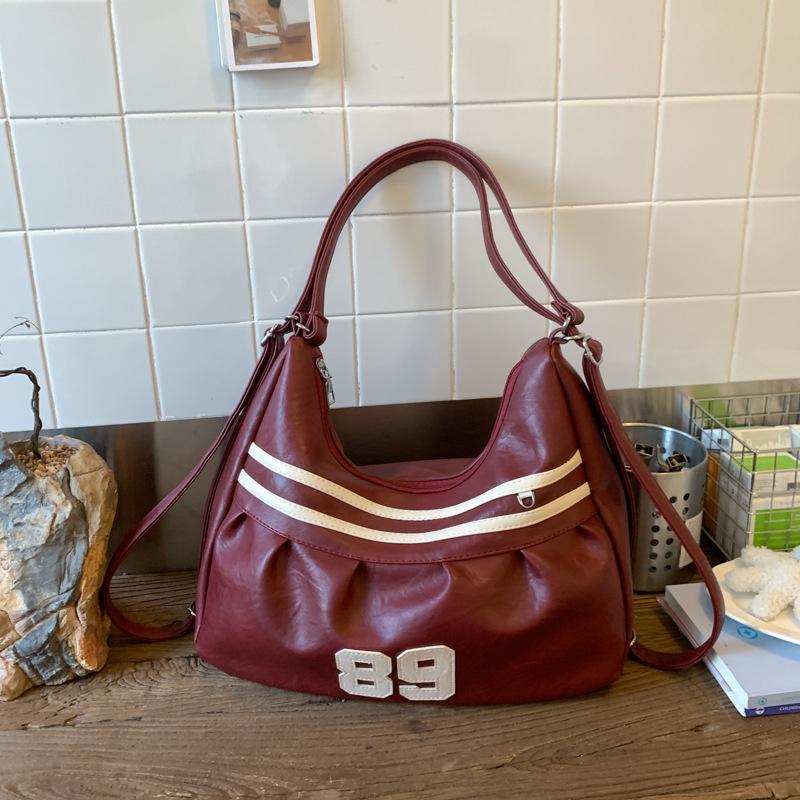 

Женская сумка-тоут большой вместимости 2025 новая осень и зима нишевый дизайн на одно плечо через плечо сумка для поездок на работу многофункциональный рюкзак красный