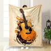 A Guitar Surrounded by Swirling Orange and Black Abstract Designs. for All Seasons Blanket Lunch Break Throw Gift