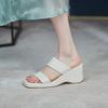 In the summer of 2025, the new thick-soled muffin sandals for women wear one-word cool slippers with a high heel and a half drag.