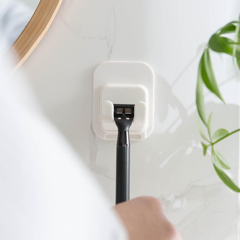 Wandaufbewahrungshaken Steckdosenhalter Stanzfreier Wandhaken Kleiderbügel Rasiererhalter Ständer Kleiderbügel Türhaken Schlüsselhalter
