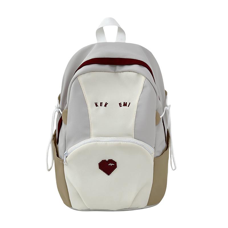 Exquisite and cute color matching large-capacity load reduction male and female student schoolbags 25 new casual size backpacks