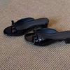 2025 new French patent leather black bow sandals women's versatile simple low-heeled casual open-toed slippers
