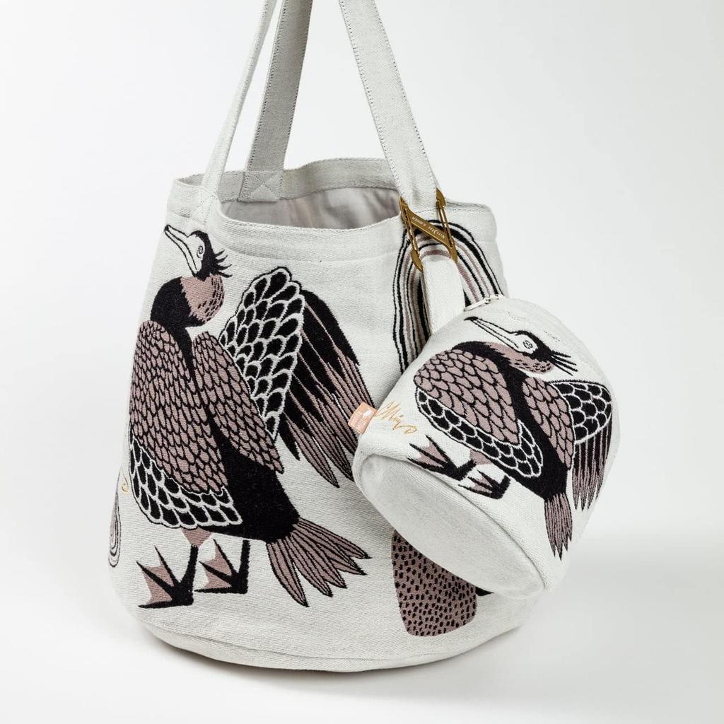 Morita MiW Gusseted Pouch, featuring a smiling riverside cormorant. Ivory. A charming, round shape. Made of thick, tightly woven fabric with a